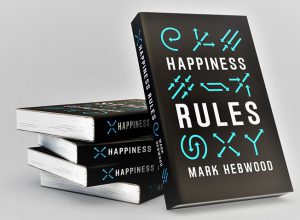 Happiness Rules books displayed on a table